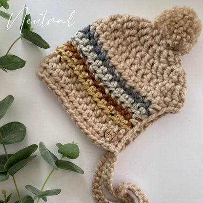 Rainbow bonnet with pompom and ties