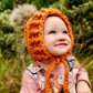 Pumpkin Pixie bonnet with pompom, twizzle and leaf